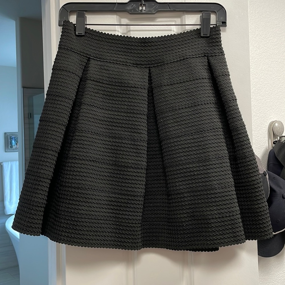 Black pleated mini skirt